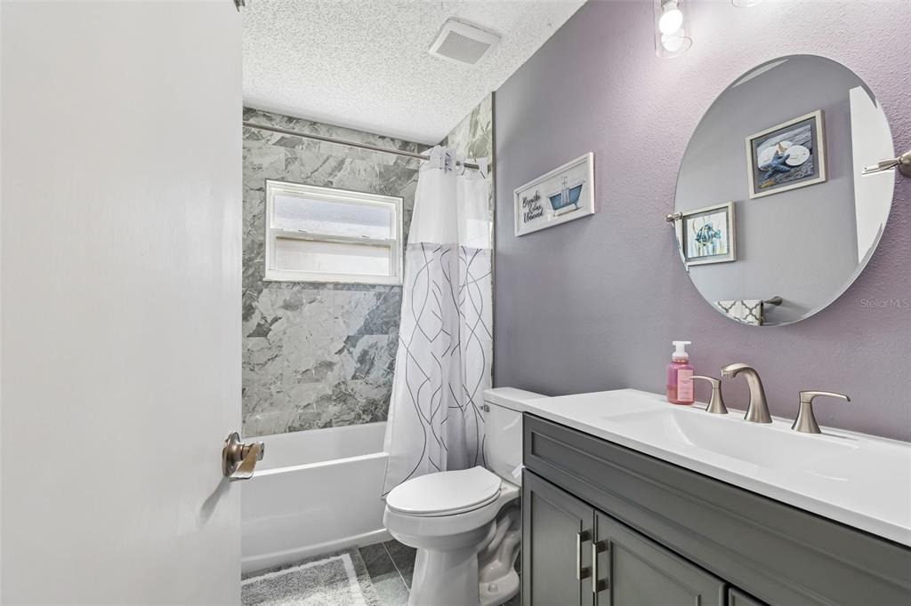 5478 Waycross Drive Spring Hill, FL 34606 - Photo 22 of 29 a bathroom with a sink toilet and shower