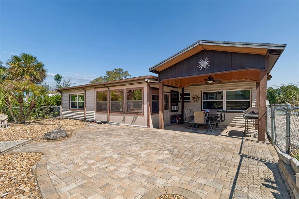 5478 Waycross Drive Spring Hill, FL 34606 - Photo 26 of 29 a front view of a house with yard outdoor seating and patio