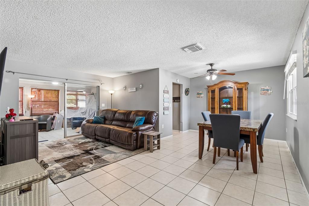 5478 Waycross Drive Spring Hill, FL 34606 - Photo 5 of 29 a living room with furniture a dining table and a window