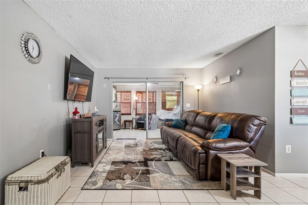5478 Waycross Drive Spring Hill, FL 34606 - Photo 6 of 29 a living room with furniture and a flat screen tv