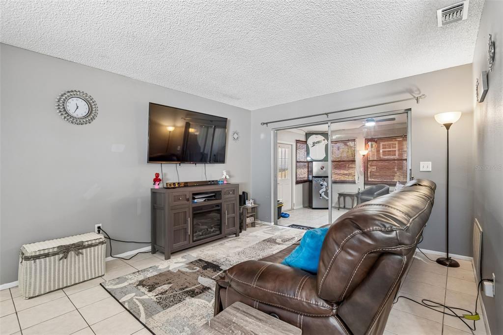 5478 Waycross Drive Spring Hill, FL 34606 - Photo 7 of 29 a living room with furniture and a flat screen tv