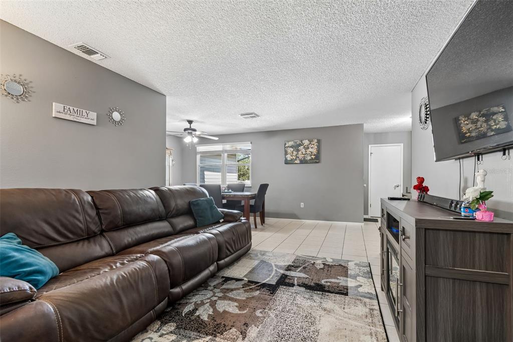 5478 Waycross Drive Spring Hill, FL 34606 - Photo 8 of 29 a living room with furniture and a flat screen tv
