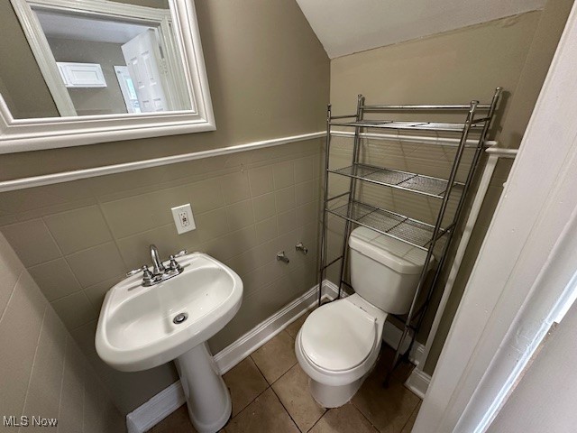3282 Yorkshire Road Cleveland, OH 44118 - Photo 11 of 33 Bathroom with tile walls, tile patterned flooring, and toilet