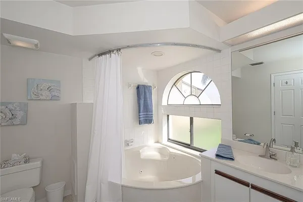 a kitchen with granite countertop cabinets and chairs
