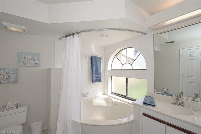 a kitchen with granite countertop cabinets and chairs
