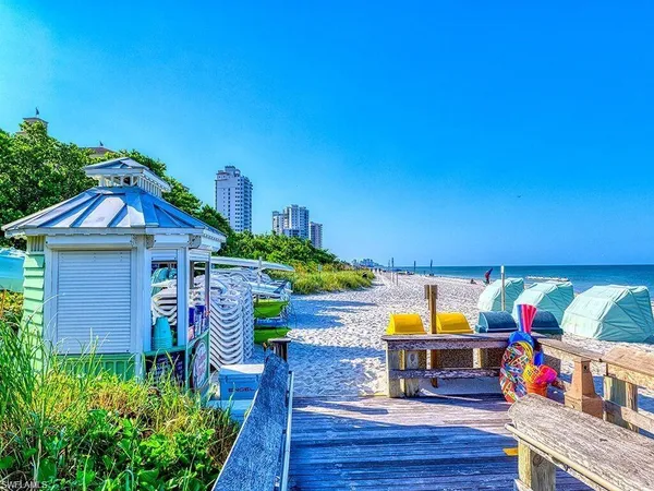 a view of a building with garden and trees