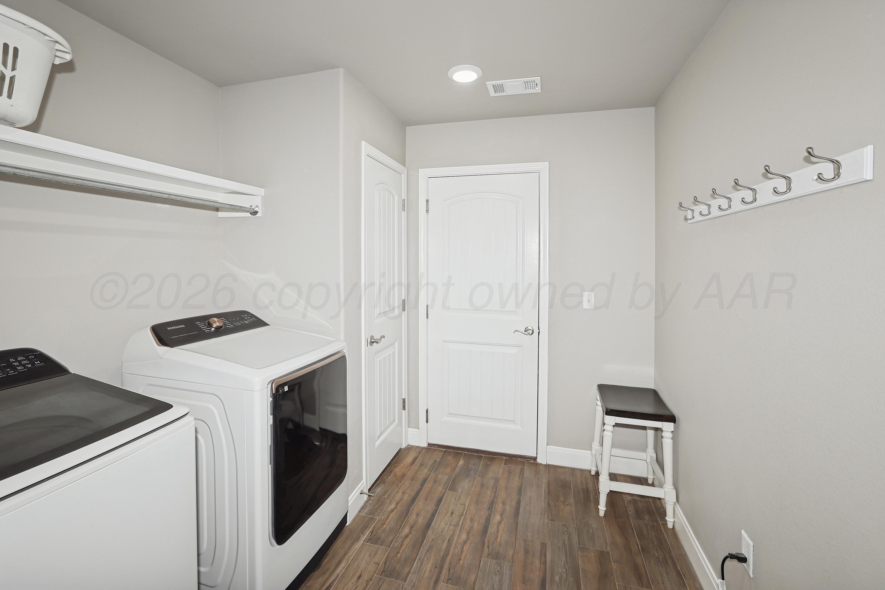 9715 Mossberg Street Canyon, TX 79015 - Photo 12 of 32 a view of a storage & utility room with washer and dryer