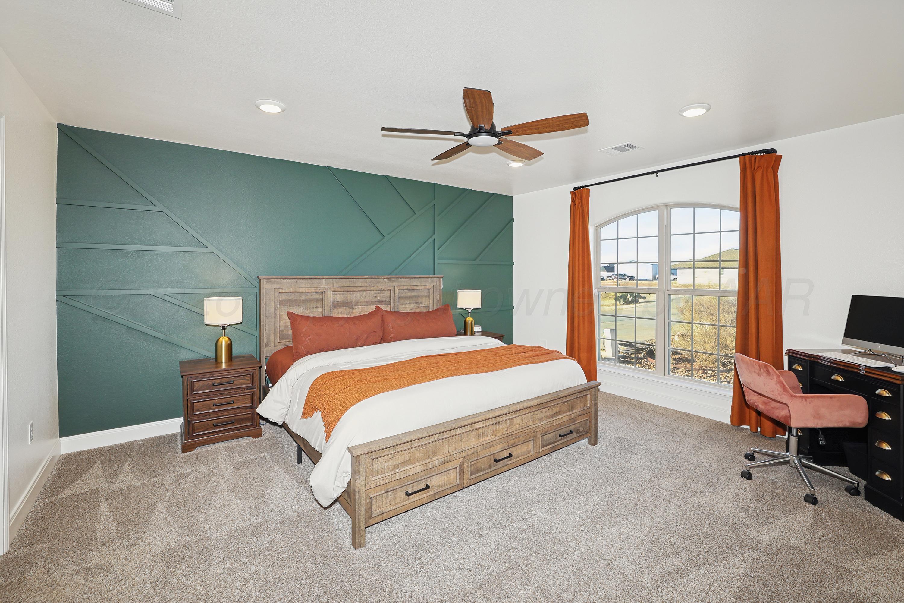 9715 Mossberg Street Canyon, TX 79015 - Photo 13 of 32 a bedroom with a bed and large window