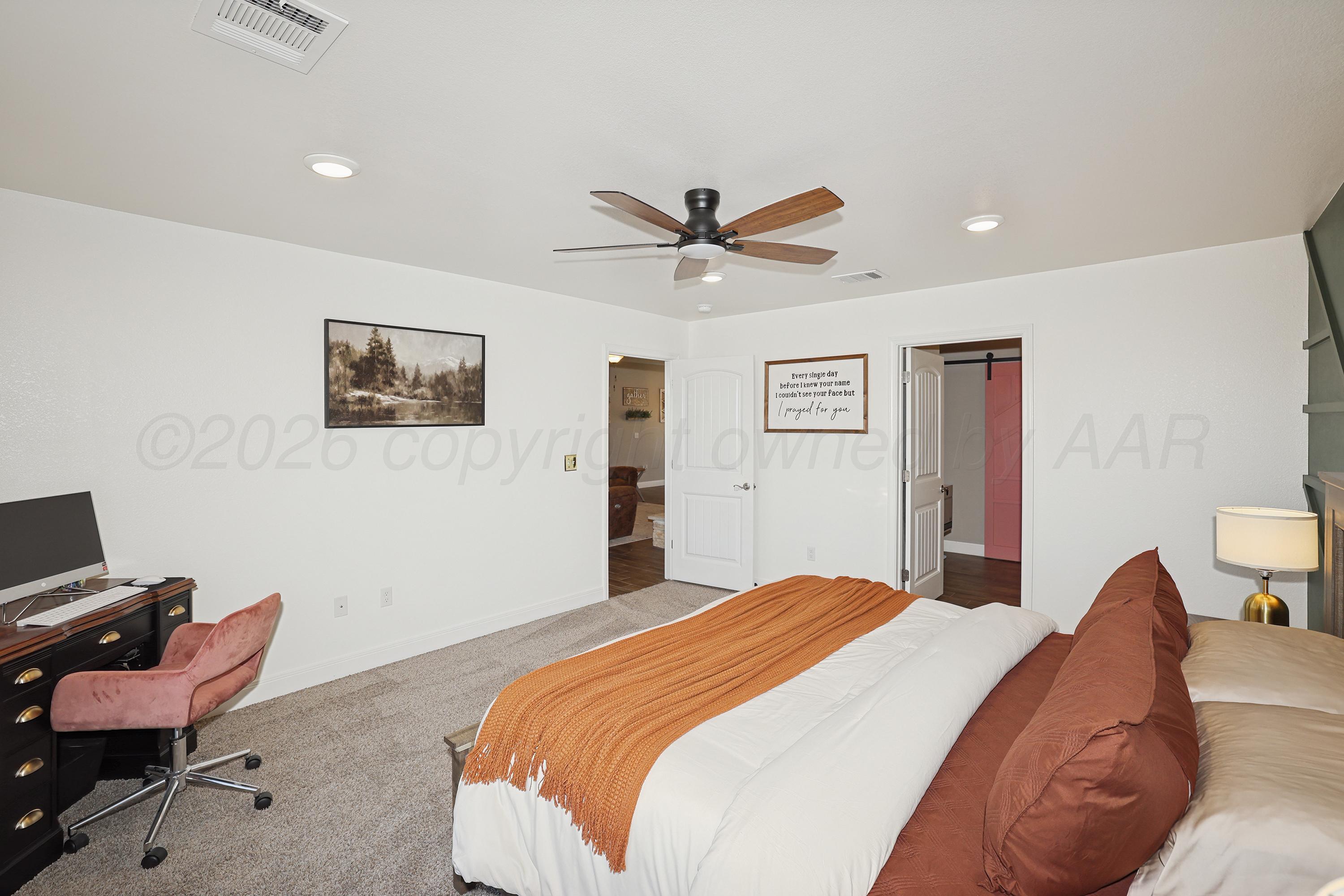 9715 Mossberg Street Canyon, TX 79015 - Photo 14 of 32 a bedroom with a bed and a chair