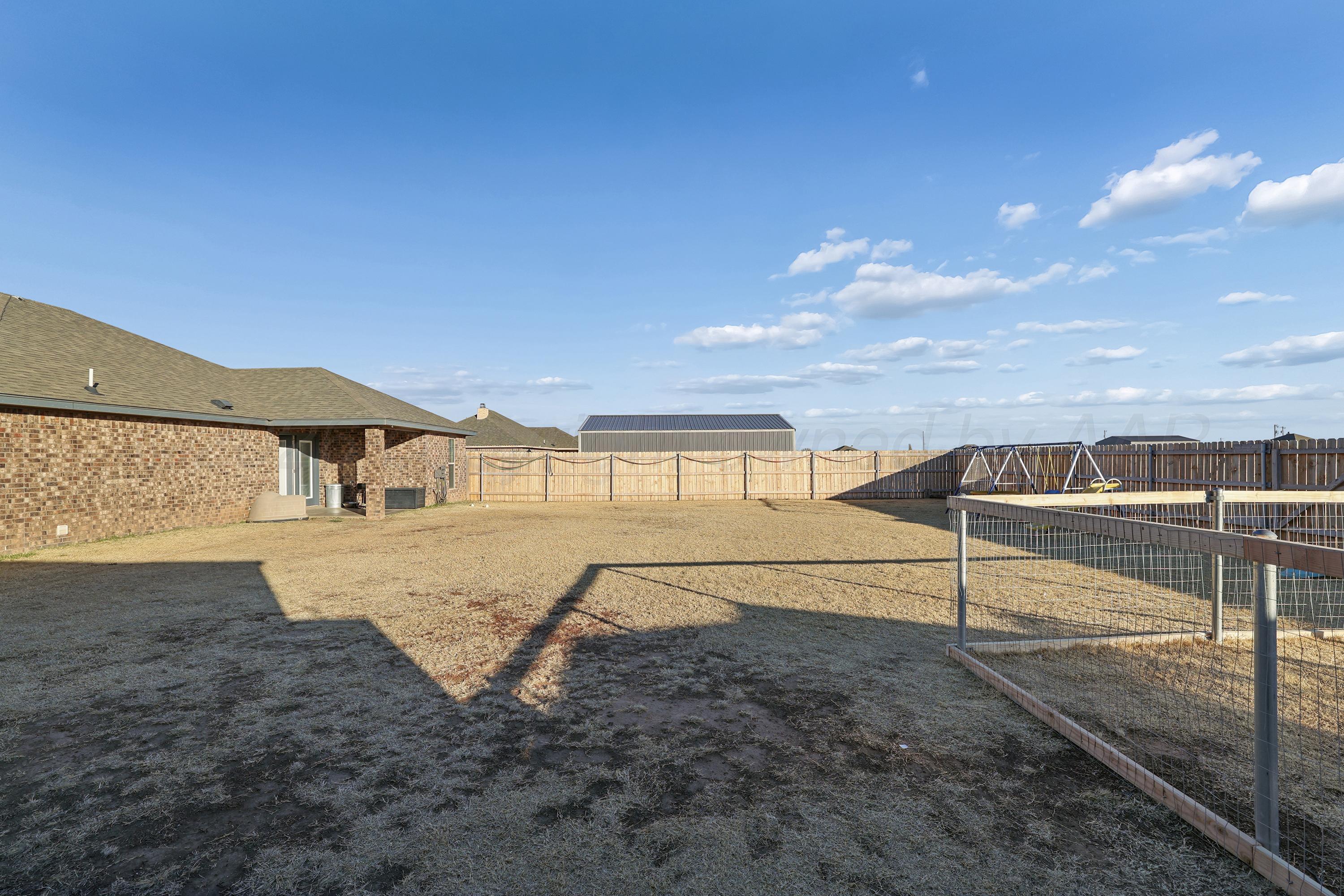 9715 Mossberg Street Canyon, TX 79015 - Photo 27 of 32 a view of a terrace with a yard
