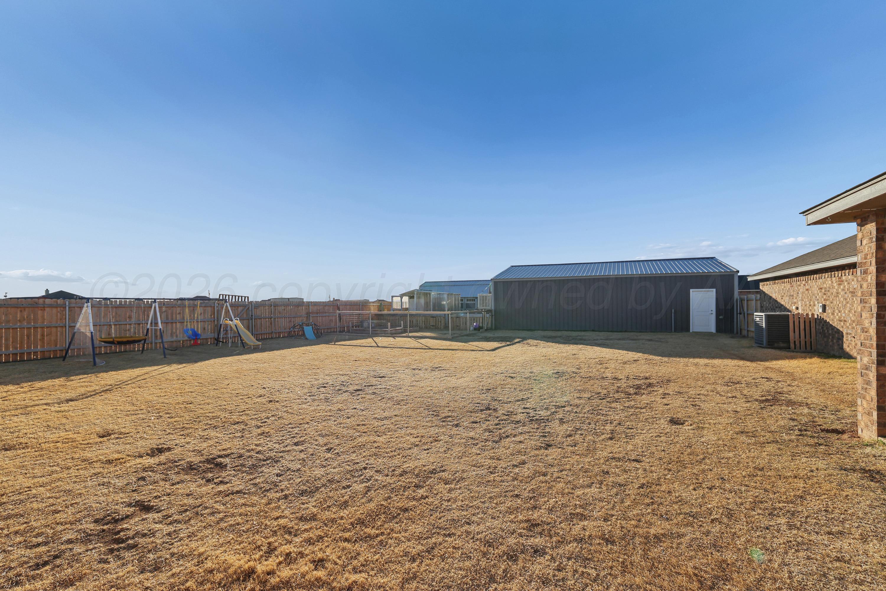 9715 Mossberg Street Canyon, TX 79015 - Photo 28 of 32 a backyard of a house