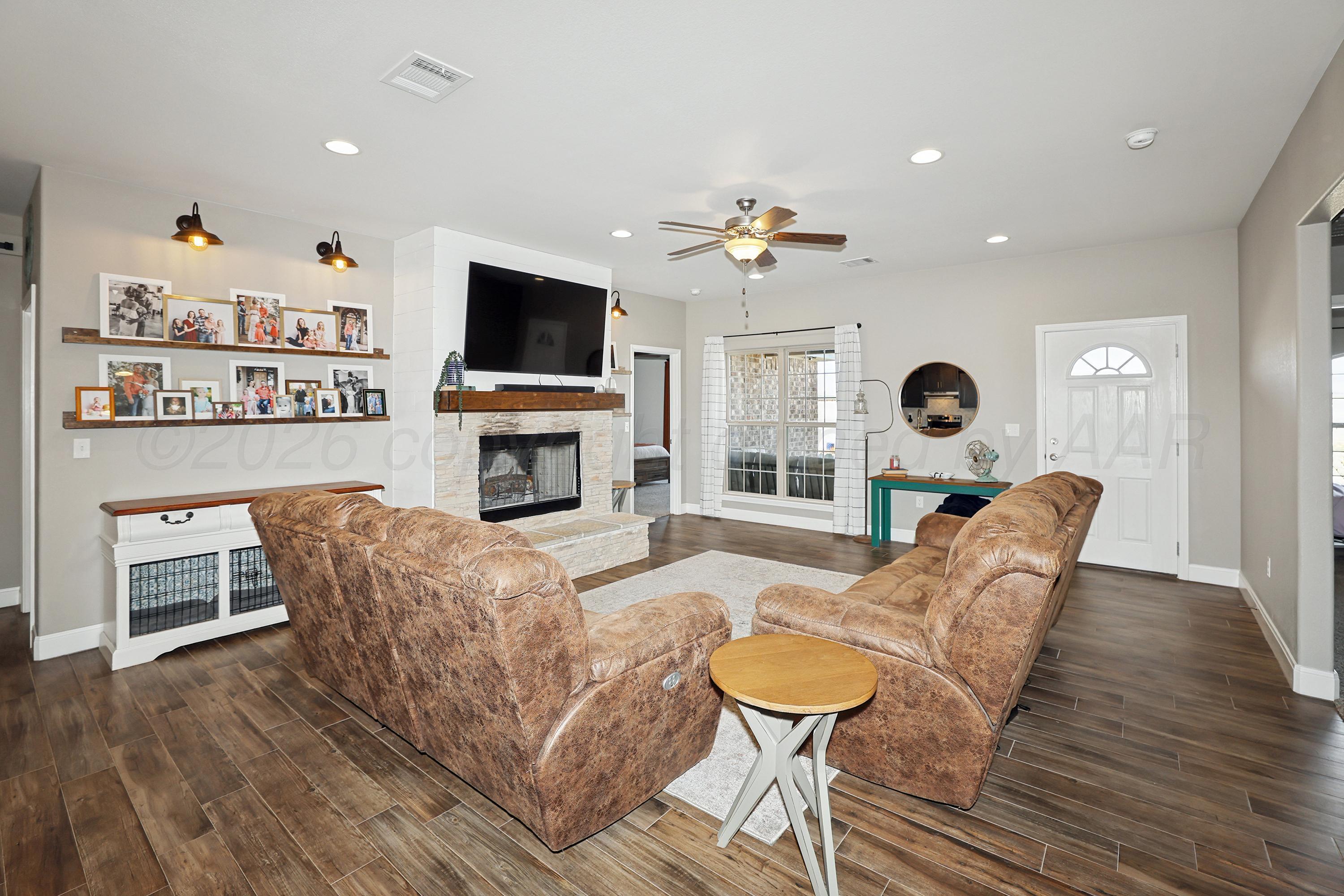 9715 Mossberg Street Canyon, TX 79015 - Photo 6 of 32 a living room with furniture and a flat screen tv