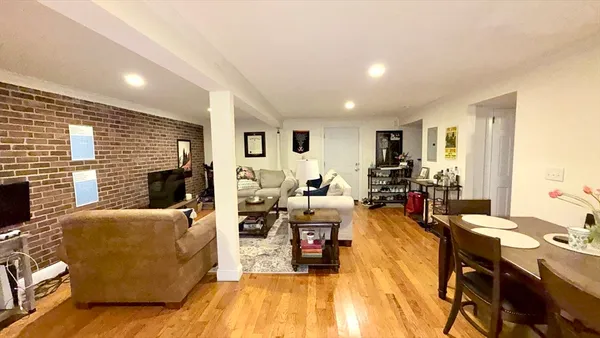 a living room with fireplace furniture and a flat screen tv