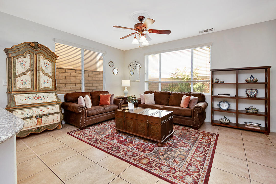 28938 Mirada Circulo Valencia, CA 91354 - Photo 16 of 56 a living room with furniture and a floor to ceiling window