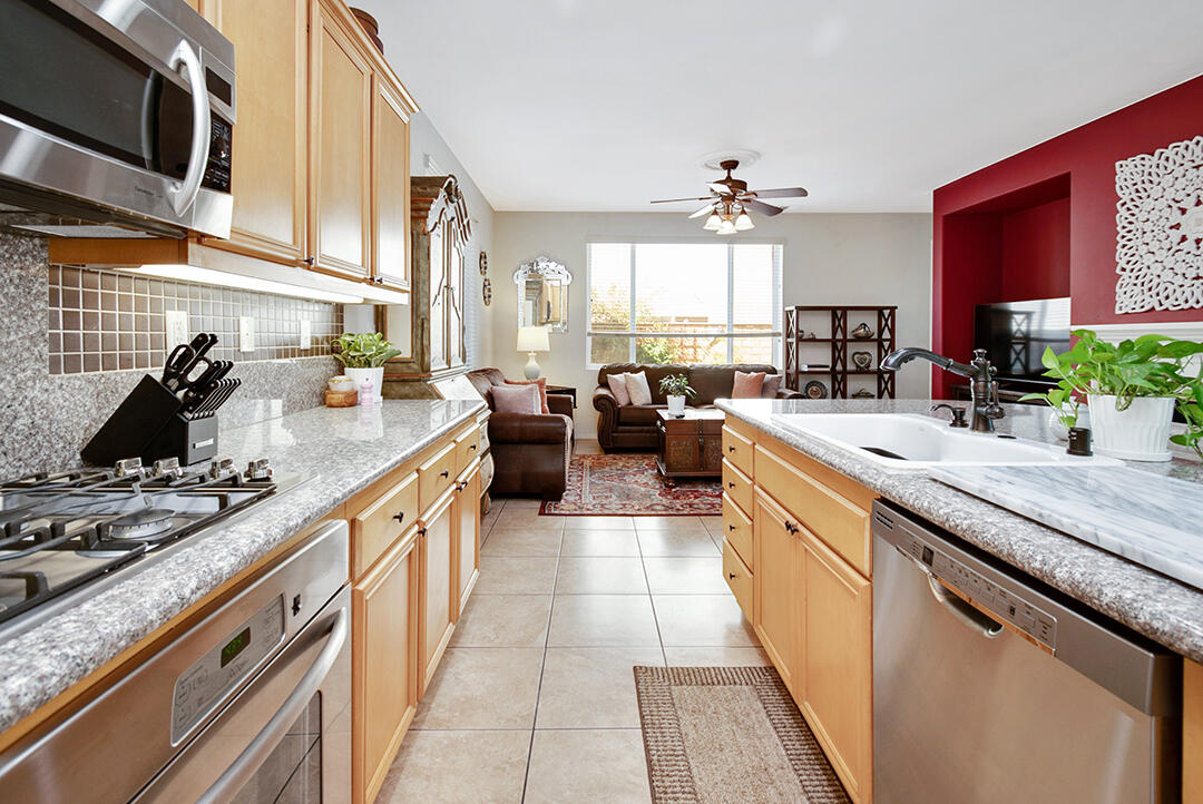 28938 Mirada Circulo Valencia, CA 91354 - Photo 18 of 56 a open kitchen with stainless steel appliances granite countertop a sink stove and cabinets