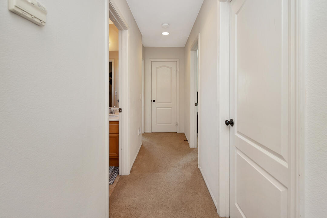 28938 Mirada Circulo Valencia, CA 91354 - Photo 33 of 56 a view of a hallway with wooden floor