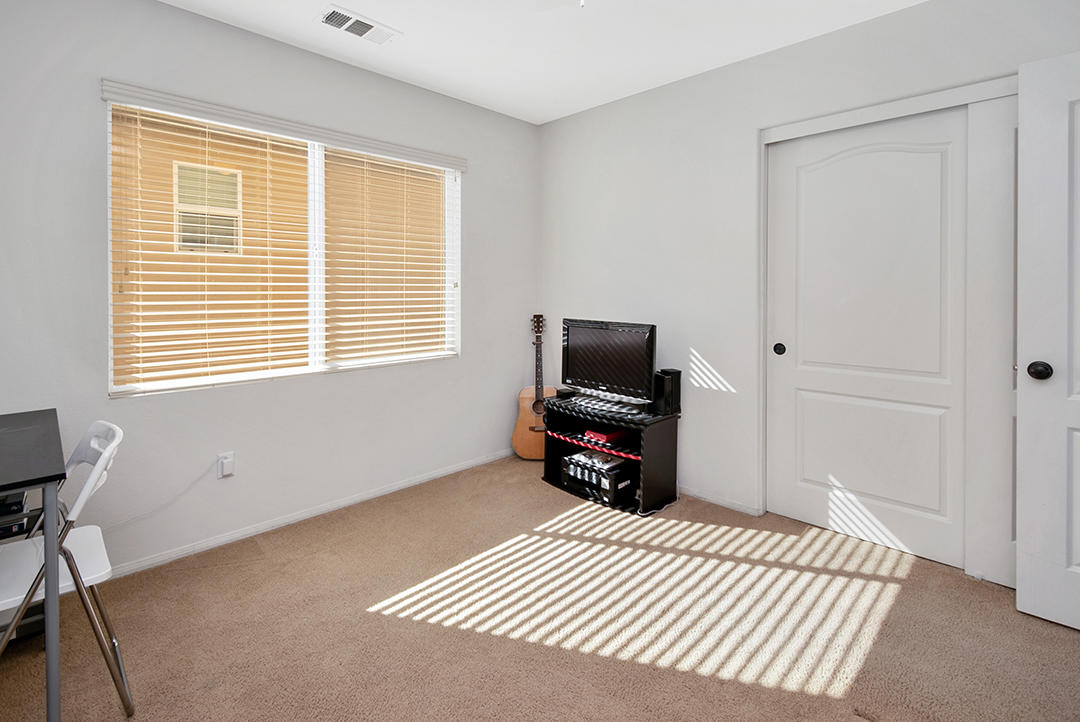28938 Mirada Circulo Valencia, CA 91354 - Photo 35 of 56 a bedroom with a bed a television and a window