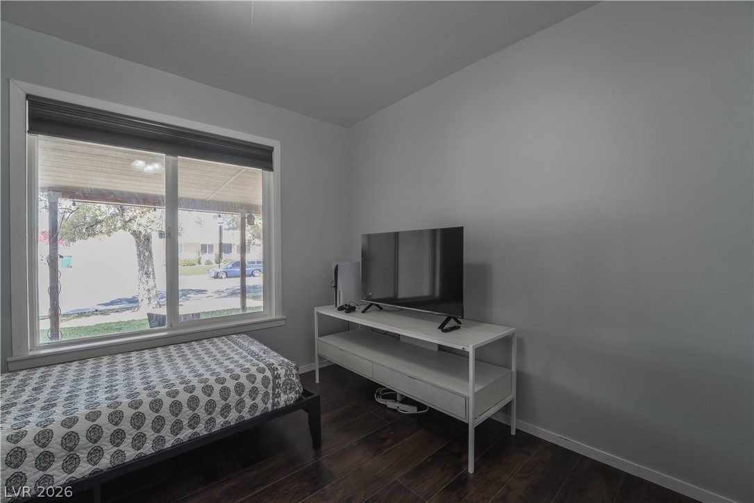 1324 Appaloosa Road Boulder City, NV 89005 - Photo 29 of 42 Rich hardwood floors complement the ample natural light in this inviting bedroom.