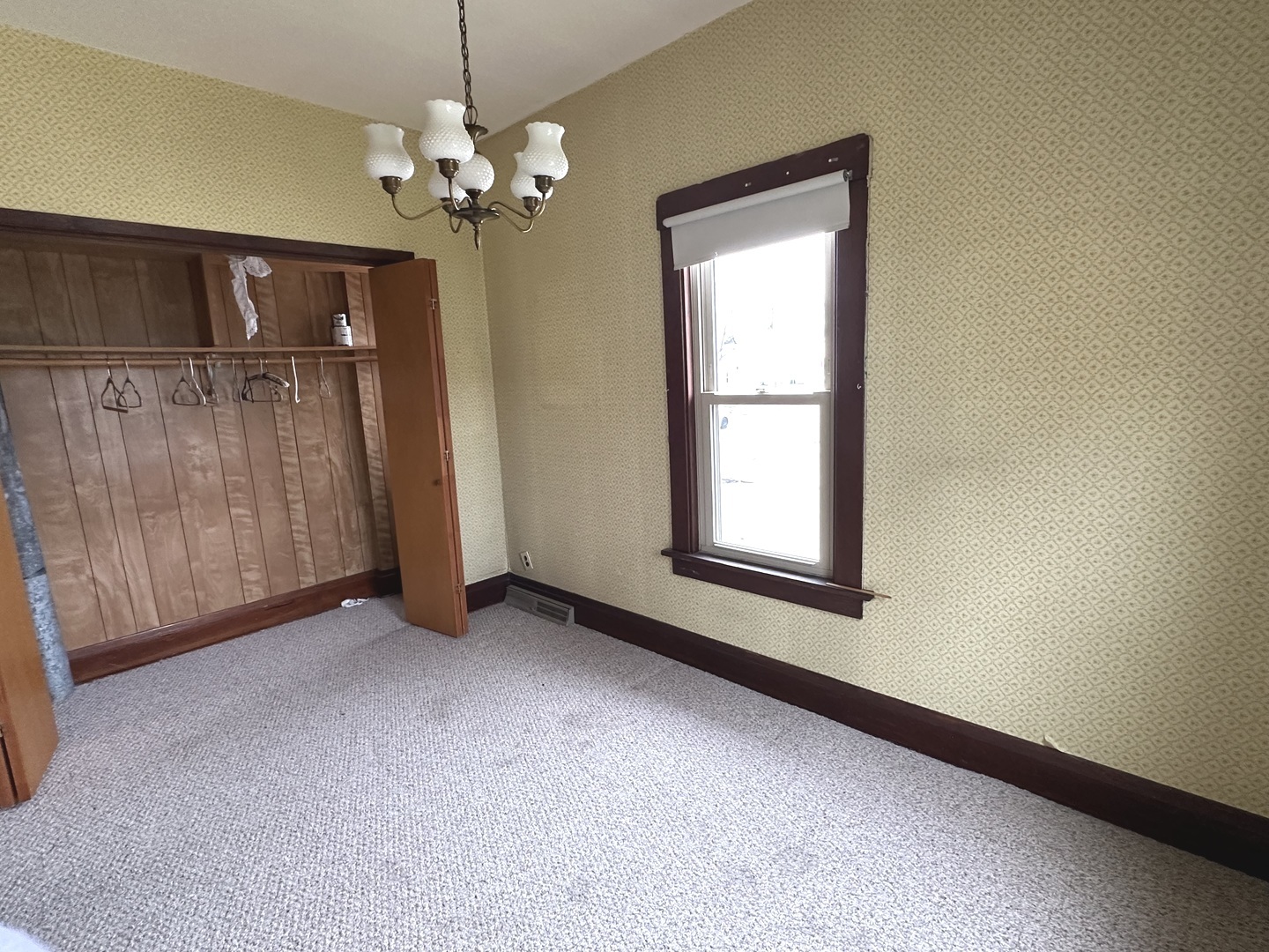 303 South Pleasant Street Princeton, IL 61356 - Photo 15 of 20 wooden floor in an empty room with a window