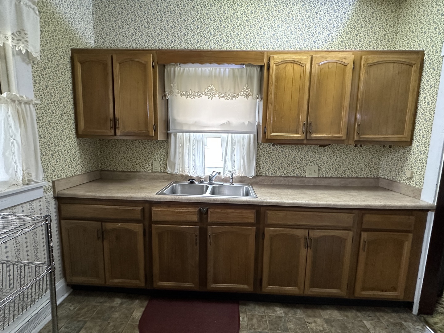 303 South Pleasant Street Princeton, IL 61356 - Photo 7 of 20 a bathroom with a sink and a mirror
