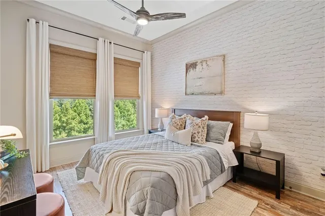 a bedroom with a large bed and a window