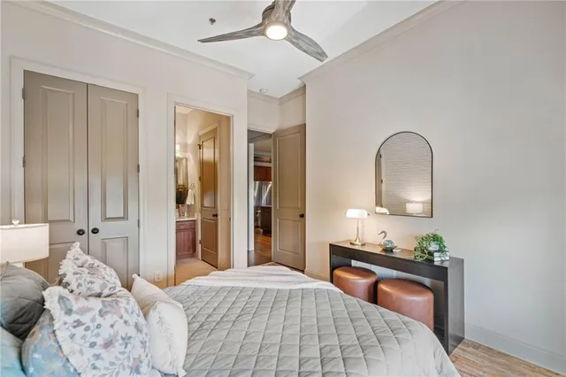 a bedroom with a bed and a dresser