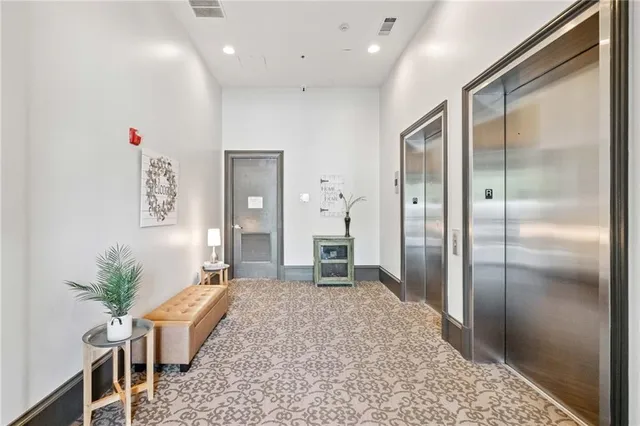 a spacious bathroom with a granite countertop sink a toilet and shower