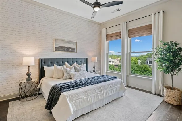 a bedroom with a large bed and a window