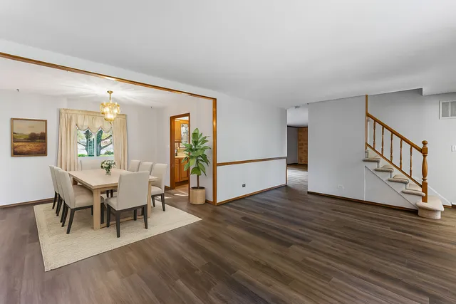 a view of a livingroom with furniture and wooden floor