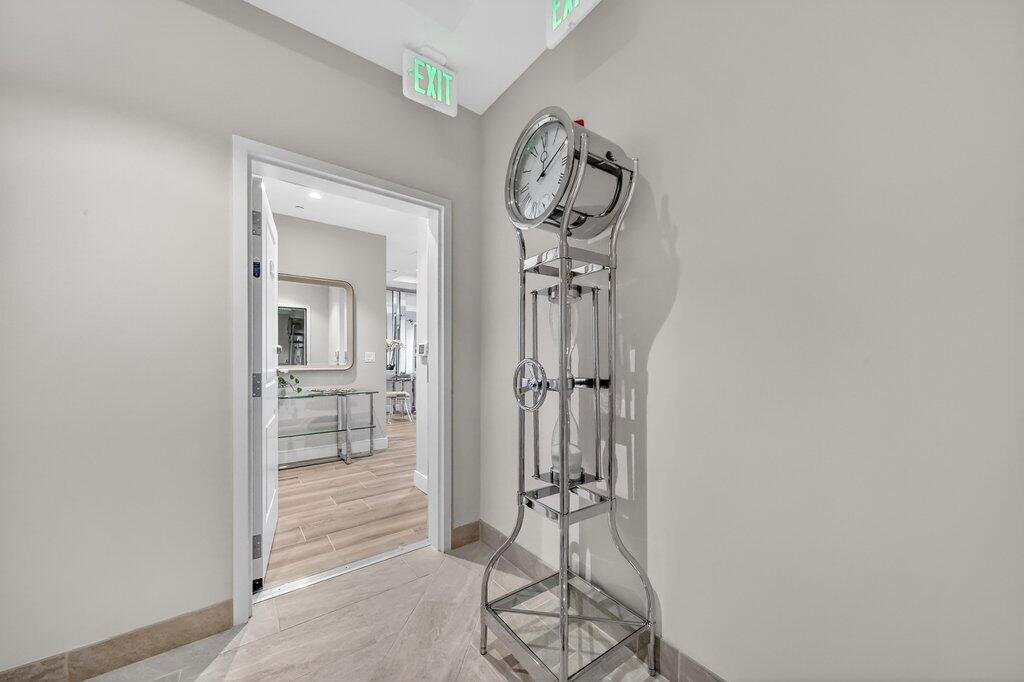41 Southwest Seminole Street, Unit 304 Stuart, FL 34994 - Photo 18 of 29 a view of a hallway with a glass door and a window