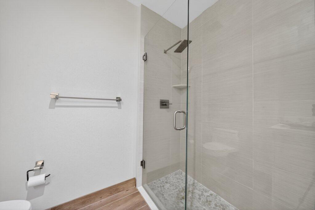 41 Southwest Seminole Street, Unit 304 Stuart, FL 34994 - Photo 7 of 29 a bathroom with a shower