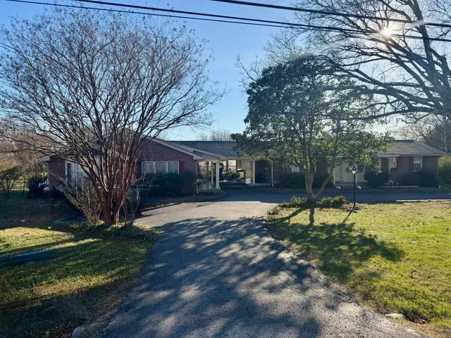 a house with trees in the background