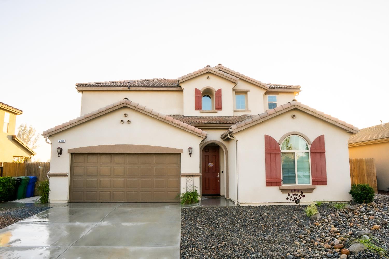 470 Daphne Lane Lemoore, CA 93245 - Photo 11 of 86 a front view of a house with garden