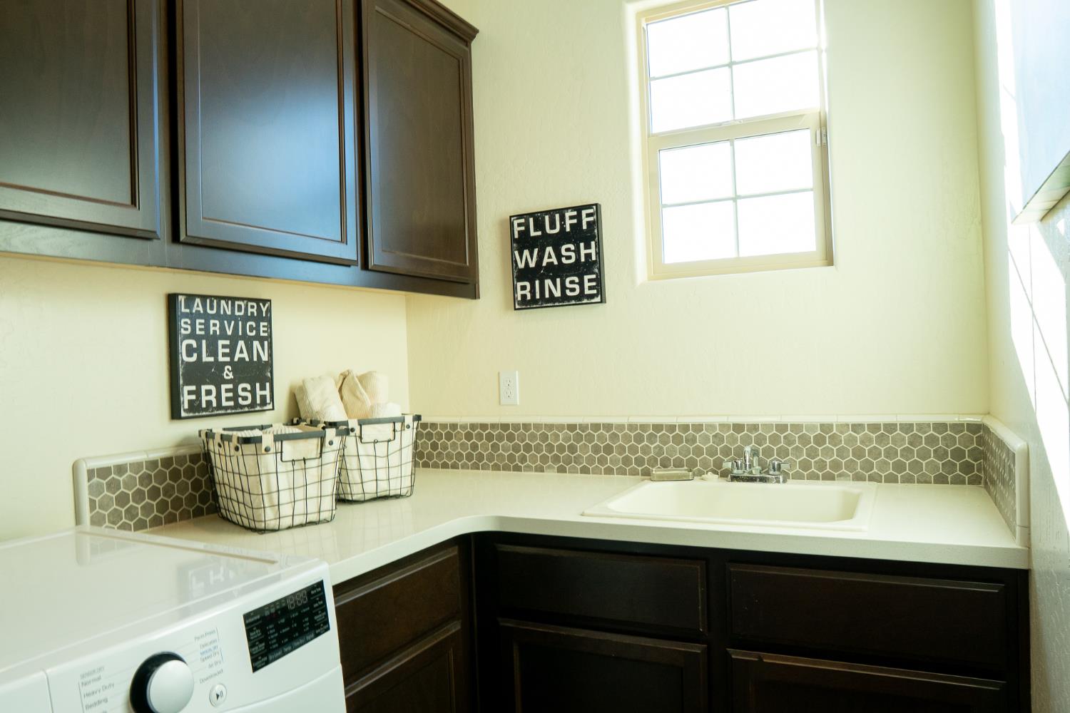 470 Daphne Lane Lemoore, CA 93245 - Photo 27 of 86 a kitchen with a sink and cabinets