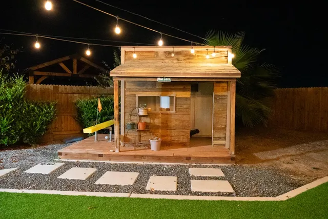 a view of a porch with a table and chairs