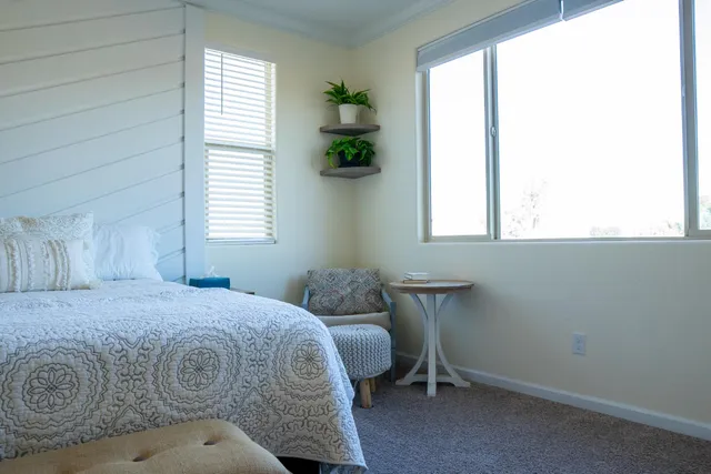 a kitchen with stainless steel appliances kitchen island granite countertop a kitchen island a stove a table and chairs