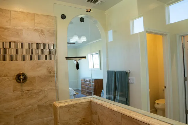 a view of a hallway with wooden shelves