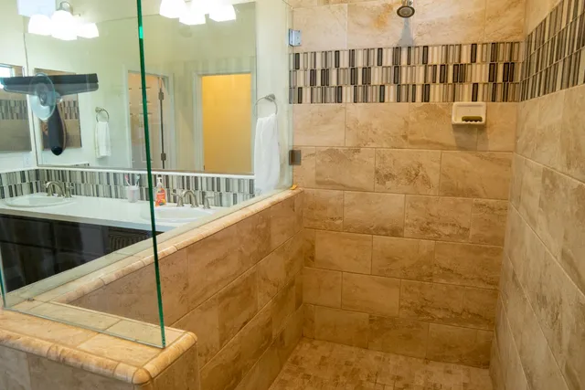 a living room with furniture and kitchen view