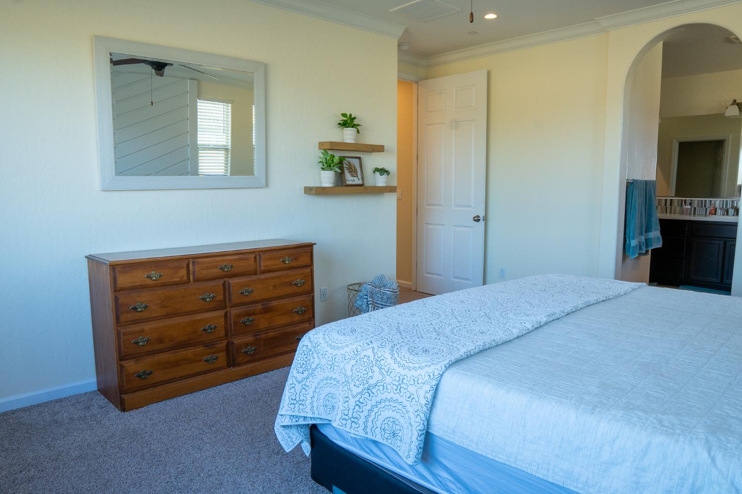 470 Daphne Lane Lemoore, CA 93245 - Photo 46 of 86 a bedroom with a bed and a television