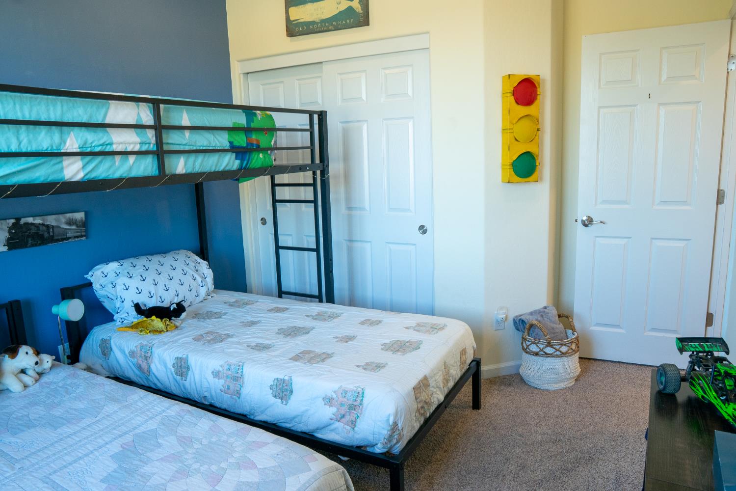 470 Daphne Lane Lemoore, CA 93245 - Photo 62 of 86 a bedroom with a bed and a potted plant