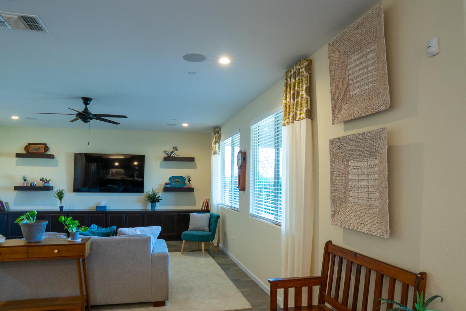 470 Daphne Lane Lemoore, CA 93245 - Photo 70 of 86 a living room with furniture and a flat screen tv