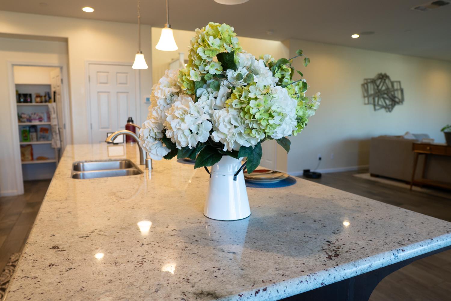 470 Daphne Lane Lemoore, CA 93245 - Photo 74 of 86 a vase of flowers sitting on a table