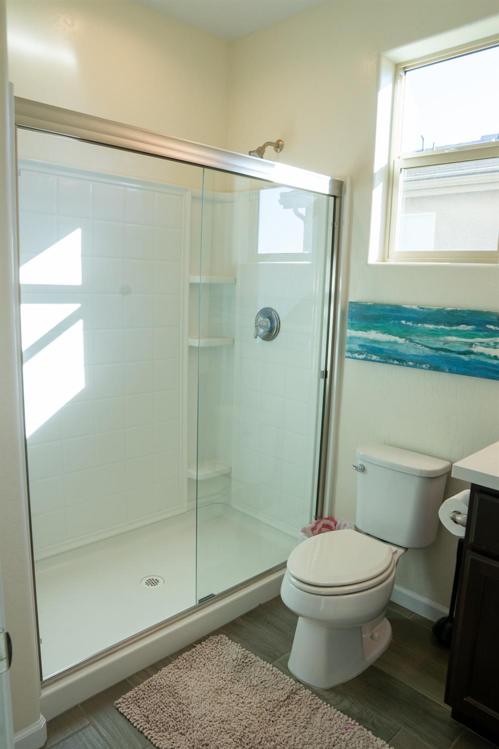 470 Daphne Lane Lemoore, CA 93245 - Photo 79 of 86 a bathroom with a toilet and a shower