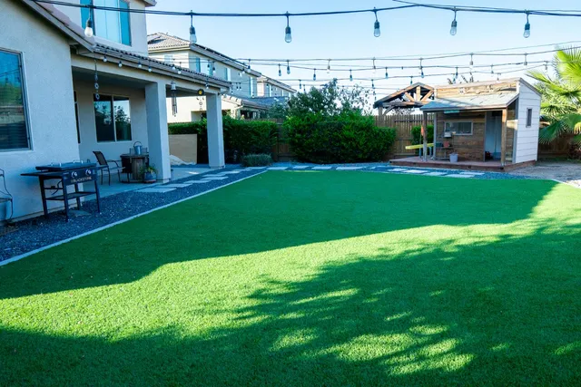 a kitchen with granite countertop stainless steel appliances a stove a microwave and sink