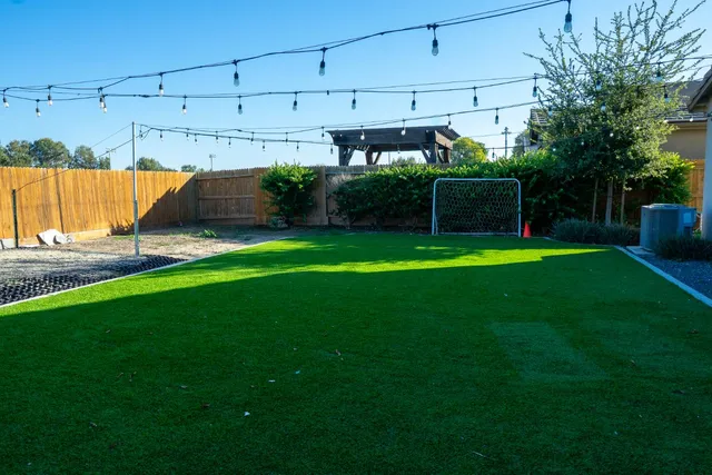 a front view of a house with a yard table and chairs