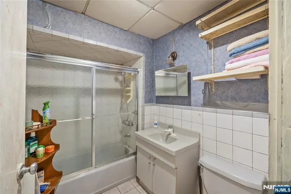 a utility room with cabinets dryer and washer