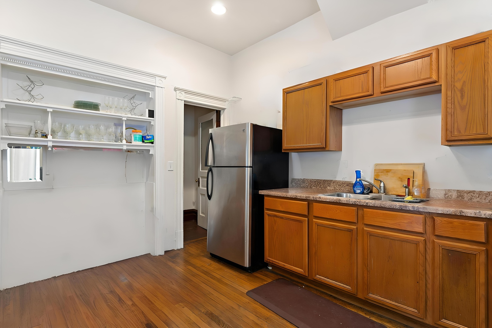 1132 East 44th Street Chicago, IL 60653 - Photo 12 of 23 a kitchen with a refrigerator and a sink