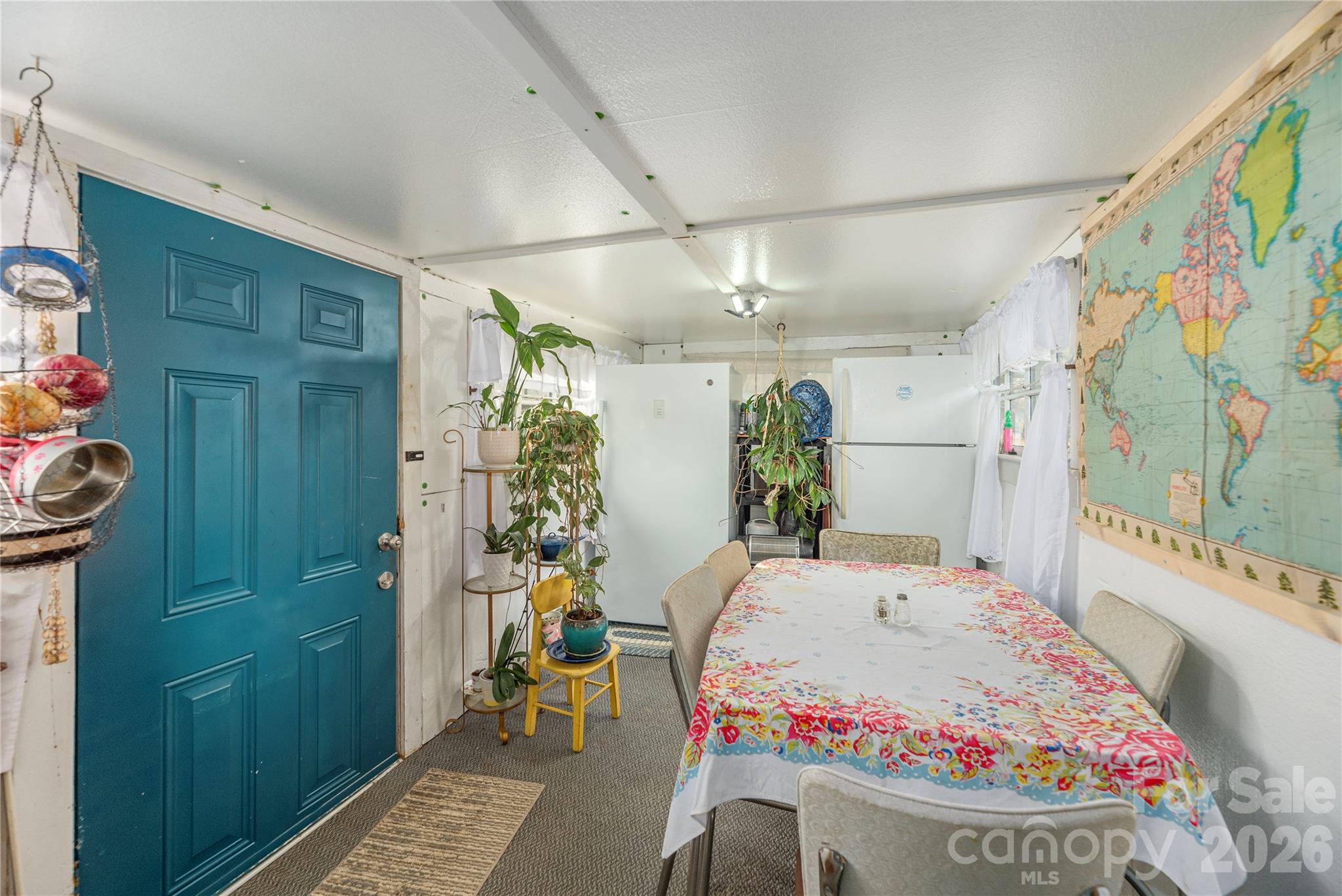 1496 Allens Creek Road Waynesville, NC 28786 - Photo 13 of 25 a bedroom with a bed and a painting on the wall