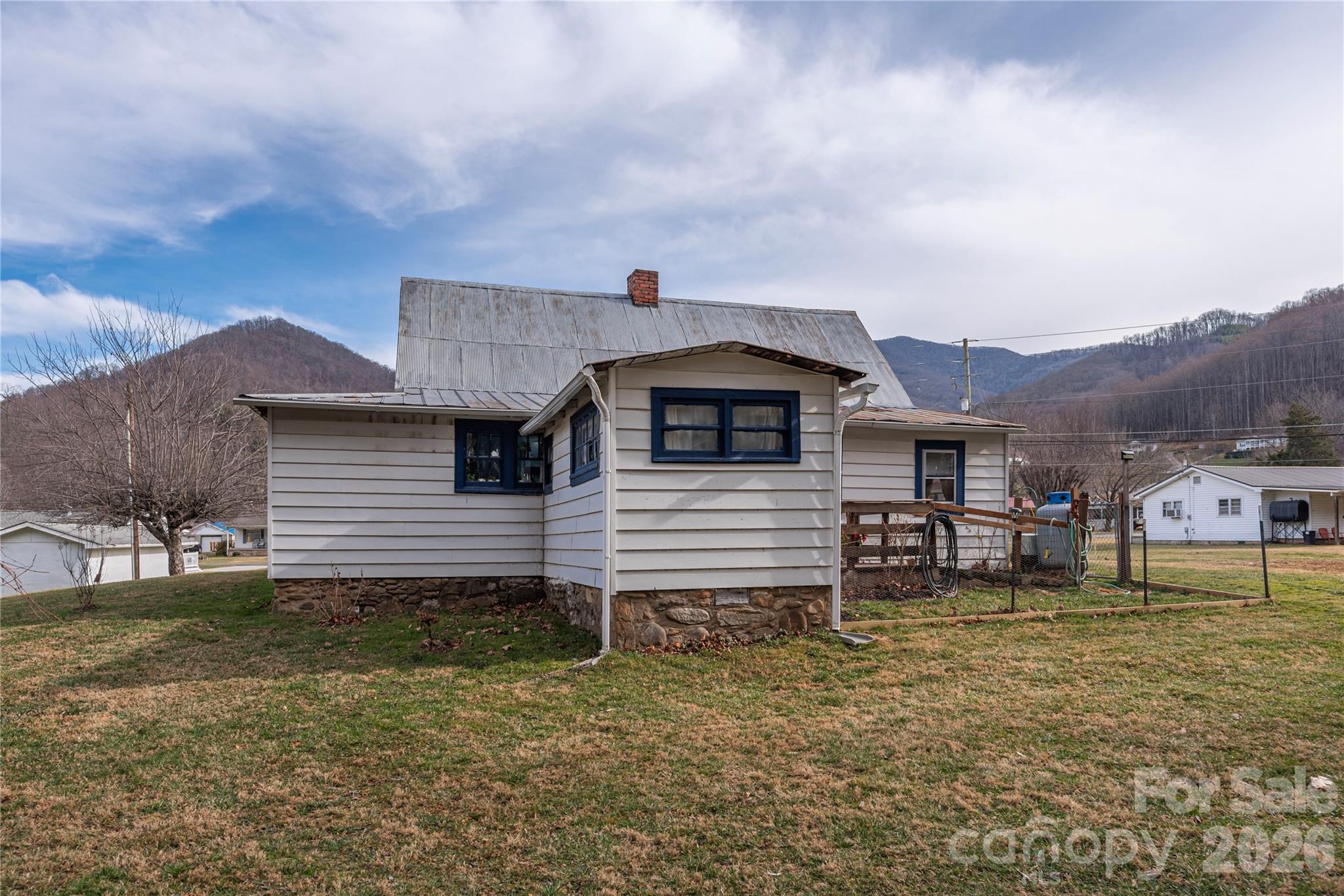 1496 Allens Creek Road Waynesville, NC 28786 - Photo 16 of 25 a view of a house with a yard and sitting area