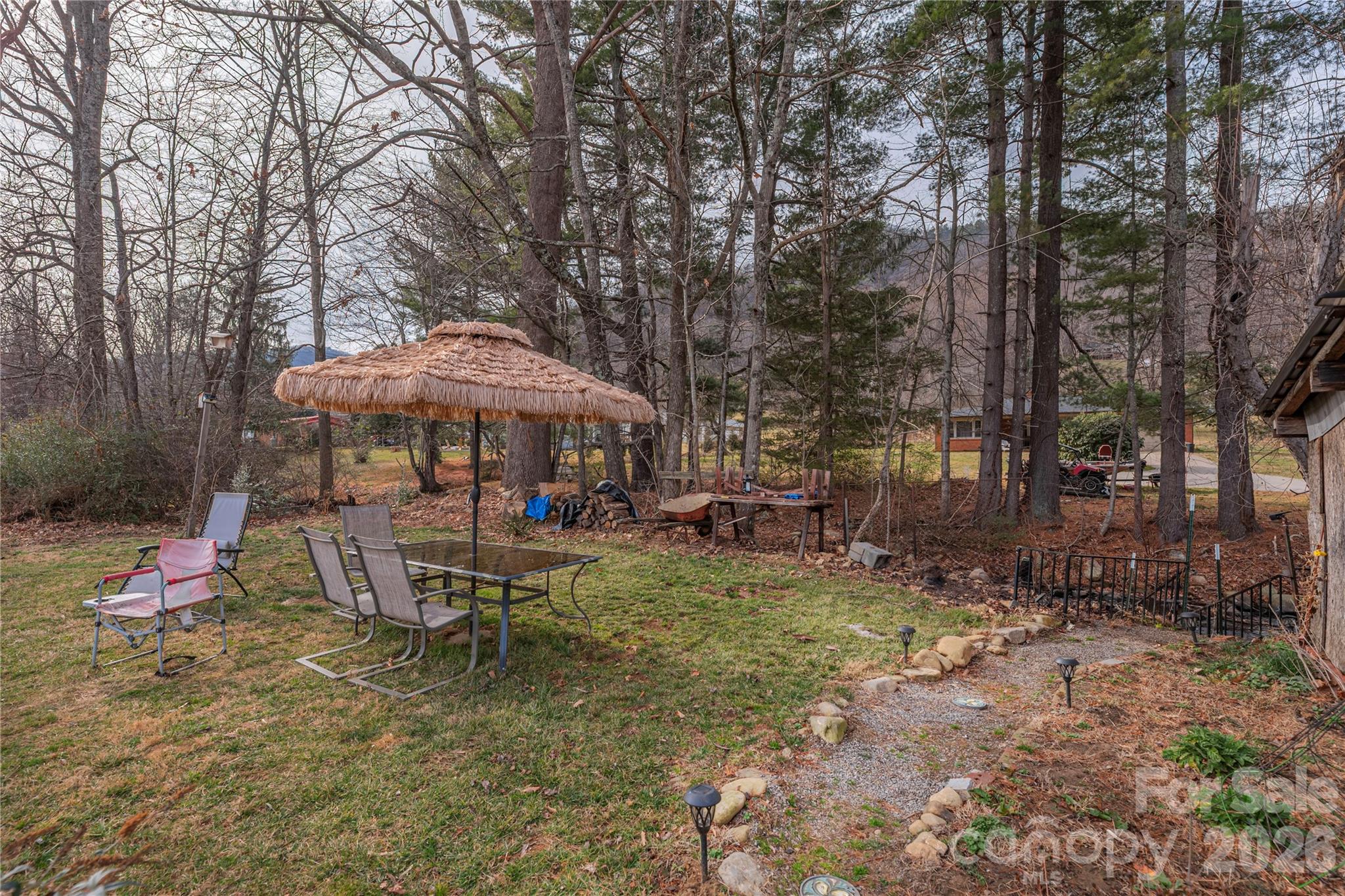 1496 Allens Creek Road Waynesville, NC 28786 - Photo 19 of 25 a garden view with a seating space